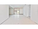 Bright and airy living room featuring tile flooring and a view of the backyard at 441 Kentia Rd, Casselberry, FL 32707