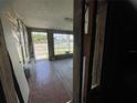 Commercial space showing original floor, expansive windows, and in need of complete renovation at 4950 Silver Star Rd, Orlando, FL 32808