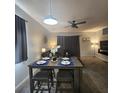 Cozy dining area featuring a modern table set for four, with stylish lighting and decor at 746 Terra Lago St, Davenport, FL 33897