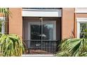 Relaxing screened in balcony with seating area, perfect for enjoying the outdoors at 1351 Venezia Ct # 201, Davenport, FL 33896