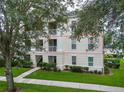 Inviting multi-level exterior featuring beautiful landscaping and charming balconies, ideal for relaxed outdoor enjoyment at 193 Longview Ave # 203, Celebration, FL 34747