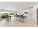 Bright, open-concept kitchen featuring an island with barstool seating at 2223 Bluebird Pl, St Cloud, FL 34771