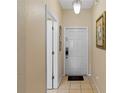 Welcoming foyer featuring tile flooring and a neutral color scheme at 2708 Camaro Dr, Kissimmee, FL 34746