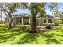 Charming single-story home with a well-manicured lawn and mature trees in a tranquil setting at 5204 Hammock Pointe Ct, St Cloud, FL 34771