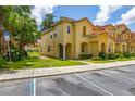 Lovely townhome with a terracotta roof, landscaped yard, and convenient parking at 7638 Long Island Dr, Kissimmee, FL 34747