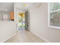 Bright foyer with tiled floor and a view of the arched entryway at 7638 Long Island Dr, Kissimmee, FL 34747
