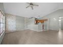 Spacious living room with bright laminate flooring and a ceiling fan at 1506 Brookebridge Dr, Orlando, FL 32825