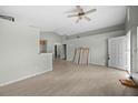 Bright living room showcasing laminate flooring, a ceiling fan, and a neutral color scheme at 1506 Brookebridge Dr, Orlando, FL 32825