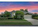 Charming home with lush landscaping and a two-car garage at 1525 Gants Cir, Kissimmee, FL 34744