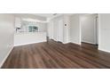 Open concept living space featuring laminate floors, fresh paint and neutral colors at 1891 Caralee Blvd # 3, Orlando, FL 32822
