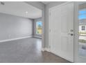 Inviting living area features neutral walls, tile floors, and plenty of natural light at 547 Viceroy Ct, Kissimmee, FL 34758