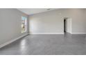 Bright, airy living area showcasing large windows and tile flooring, creating a welcoming and modern ambiance at 549 Viceroy Ct, Kissimmee, FL 34758
