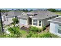 Beautiful one-story home with well-kept landscaping, brick paved drive, and two-car garage at 7834 Stoney Bay Loop, Kissimmee, FL 34747