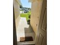 Inviting entryway with a clear view of the neighborhood and a welcome mat at 506 Myakka Pl, Kissimmee, FL 34759