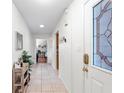 Bright entryway with tile flooring and stained glass door at 565 Lake Mystic Ln, Lakeland, FL 33813