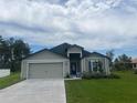 Attractive single-Gathering home with a well-manicured lawn, a two-car garage, and a welcoming entrance at 5251 Sw 164Th Street Rd, Ocala, FL 34473