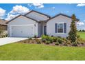 Beautiful single-Gathering home with a manicured lawn, a two-car garage, and tasteful landscaping at 418 Marion Oaks Ln, Ocala, FL 34473