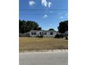Single-wide manufactured home with a spacious yard at 4316 Upper Meadow Rd, Mulberry, FL 33860