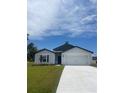 Charming single-Gathering home with a two-car garage and well-manicured lawn at 420 Marion Oaks Ln, Ocala, FL 34473