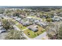 An aerial view of a residential neighborhood showcasing the surrounding landscape and community at 1803 Fredricksburg Ave, Lakeland, FL 33803