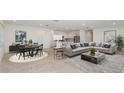 Bright open-concept living room with contemporary furnishings and neutral color palette at 6843 Sw 90Th Loop, Ocala, FL 34476