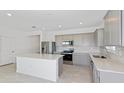 Modern kitchen with stainless steel appliances and island at 6829 Sw 90Th Loop, Ocala, FL 34476