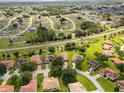 Aerial view of a residential community with houses and green spaces at 431 Bay Leaf Dr, Kissimmee, FL 34759