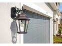 Black exterior light fixture on the side of the house at 5753 Wallis Ln, St Cloud, FL 34771