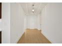 Bright entryway with light wood floors and white walls at 5783 Greenery Ln, St Cloud, FL 34771