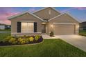 Charming single-Gathering home with a manicured lawn, neat flowerbeds, and a two-car garage at 684 Se 65Th Ter, Ocala, FL 34472