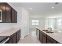 Modern kitchen with stainless steel appliances and an island at 4424 Sw 84Th Street Rd, Ocala, FL 34476