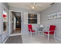 Relaxing screened-in porch with seating area, perfect for enjoying the outdoors at 3445 Roanoke St, The Villages, FL 32162