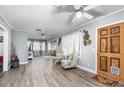 Bright living room with hardwood floors and comfy seating at 323 Nw 25Th St, Ocala, FL 34475