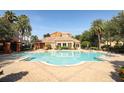 Inviting community pool with surrounding patio and landscaping at 7126 Regina Way, Orlando, FL 32819