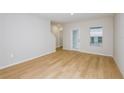 Bright, empty living room with wood-look floors, ready for new furnishings at 4337 Hillock Blvd, Haines City, FL 33844
