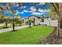 A newly renovated home with a beautiful lawn and walkway at 1716 Palmer Ave, Winter Park, FL 32789