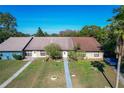Aerial view of three attached homes with landscaped yards at 3017 Jon Jon Ct, Orlando, FL 32822
