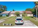 Three attached homes viewed from the driveway at 3017 Jon Jon Ct, Orlando, FL 32822