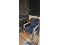 Furnished balcony with a comfortable chair and nautical decor at 1640 Juno Trl # 202E, Astor, FL 32102