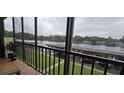 Relaxing screened balcony overlooking the water and boat docks at 1640 Juno Trl # 202E, Astor, FL 32102