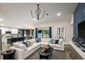 Spacious living room with sectional sofa and large artwork at 6013 Sw 96Th Pl, Ocala, FL 34476