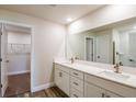 Bathroom with double vanity, spacious mirrors, and modern fixtures at 6218 Sw 95Th Pl, Ocala, FL 34476