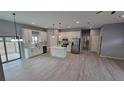 Modern kitchen featuring white cabinets, stainless steel appliances, and an island at 13898 Sw 32Nd Ter, Ocala, FL 34473