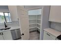Walk-in pantry with ample shelving for storage at 13898 Sw 32Nd Ter, Ocala, FL 34473