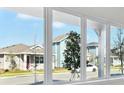 Bright living room with large windows offering neighborhood views and natural light at 3007 Mirage Pl, St Cloud, FL 34771
