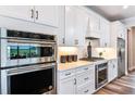 Modern kitchen featuring stainless steel appliances and white cabinets at 6019 Sw 86Th Cir, Ocala, FL 34481