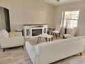 Bright living room featuring a fireplace and comfy seating at 6421 Myrtlewood Dr, Lakeland, FL 33810