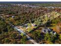Expansive lot featuring a home surrounded by lush greenery and mature trees at 2468 Fawn Run, Oviedo, FL 32765