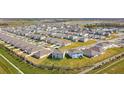 Aerial view of the Hawthorne Ranch community with lush landscaping and scenic ponds at 4897 Foxglove Dr, Lakeland, FL 33811