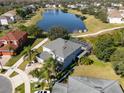 Two-story house situated on a corner lot near a lake at 13438 Davenham Pt, Orlando, FL 32832